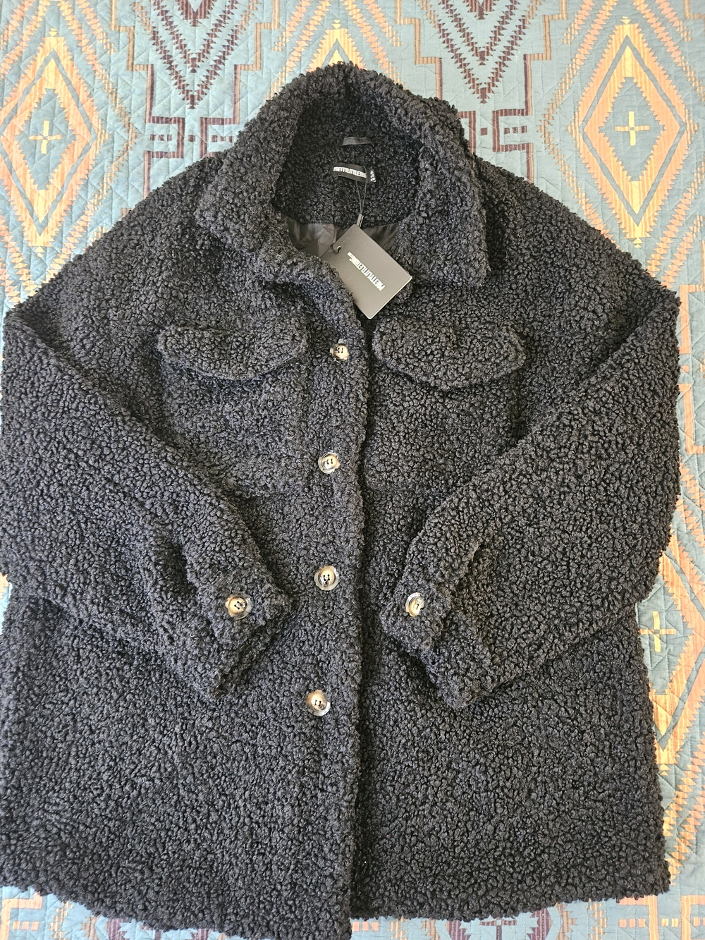 PrettyLittleThing Black Faux Sherpa Coat with Branded Tag